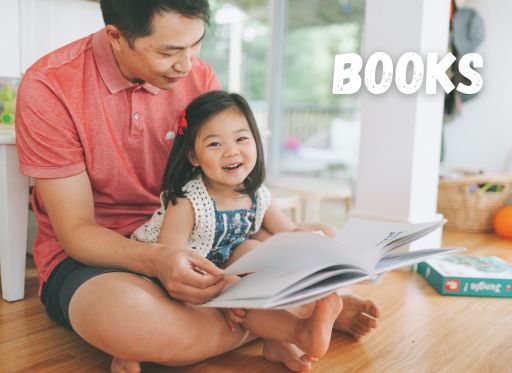 father and daughter reading book