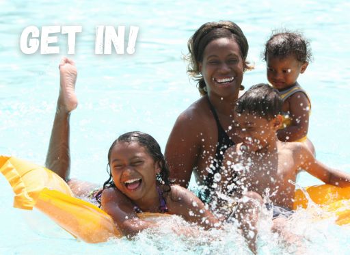 Family swimming in pool
